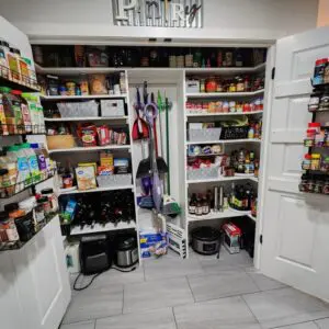 Organized pantry with shelves of food items.