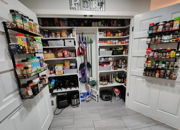 Organized pantry with shelves of food items.