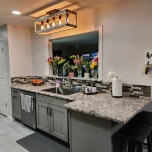 Modern kitchen with flowers and key hooks.