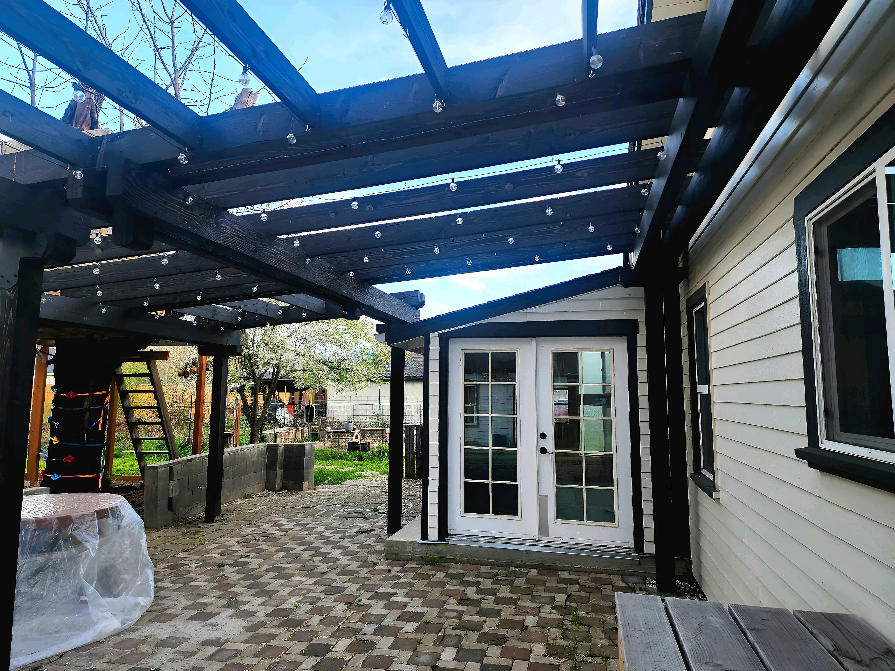 Patio with pergola and French doors.